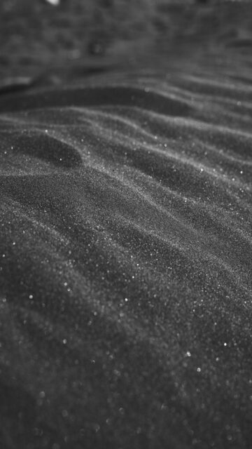 Stunning Black Sand Dunes with Glittering Particles