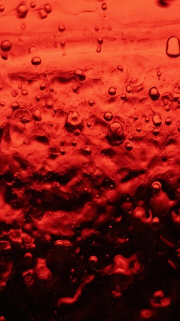 Vibrant Red Liquid with Bubbles