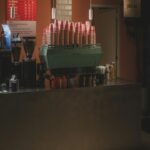 Coffee Shop Counter With Espresso Machine And Cups