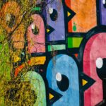 Vibrant Birds on Wall: Colorful Graffiti Art
