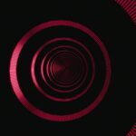 Concentric Red Circles with Vertical Lines on Black Background