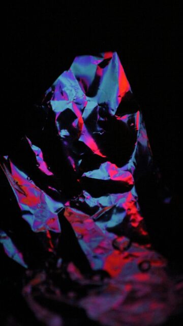 Crisp Mobile Wallpaper: Crinkled Foil with Red and Blue Lighting