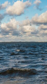 Moody Ocean Waves Under Cloudy Sky