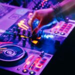 Electric Vibe: DJ Mixing Music with Colorful Lights