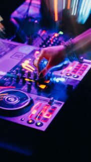Electric Vibe: DJ Mixing Music with Colorful Lights