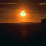 Golden Sunsets Over Cityscapes: Mobile Wallpaper