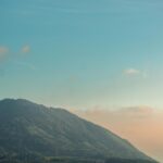 Breathtaking Blue Sky View from Green Mountainside