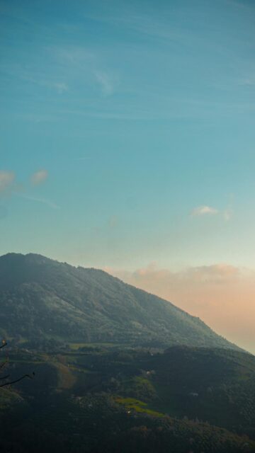 Breathtaking Blue Sky View from Green Mountainside