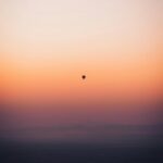 Hot Air Balloon in Vibrant Sunset Sky