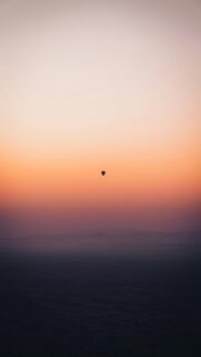 Hot Air Balloon in Vibrant Sunset Sky