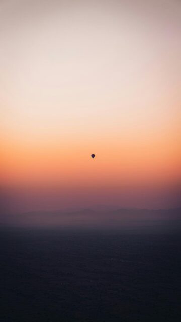 Hot Air Balloon in Vibrant Sunset Sky