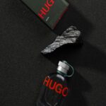 hugo-man-fragrance-bottle-and-box-on-dark-surface