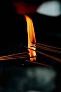 Incense Sticks Burning Bright Flame 4K Wallpaper