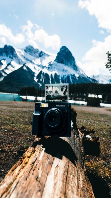Snowy Mountains Landscape with Instant Camera