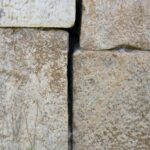 Rustic Nature: Weathered Stone Wall with Greenery