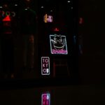 Glowing Neon Reflections on Wet Surface