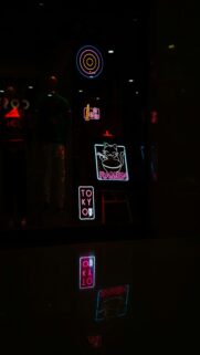 Glowing Neon Reflections on Wet Surface