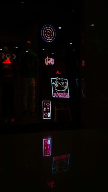 Glowing Neon Reflections on Wet Surface