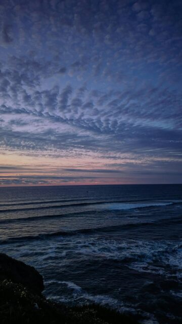 Ocean Waves at Dusk with Dramatic Clouds