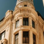 Ornate Building with Dome and Balcony under Blue Sky