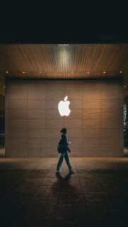Illuminated Apple Logo on Wall for Mobile Wallpaper