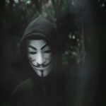 Guy Fawkes Mask in Dark Forest Wallpaper