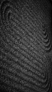 Raked Sand With Swirling Patterns In Black And White