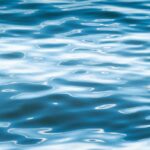 Rippling Blue Water Surface with Light Reflections