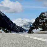 Breathtaking Road to Snowy Peaks Wallpaper