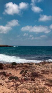 Rocky Coastline Wallpaper: Waves Crashing on Shore