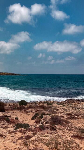 Rocky Coastline Wallpaper: Waves Crashing on Shore