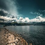Calm Ocean Meeting Dramatic Skies