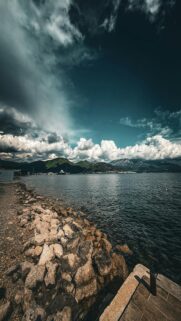 Calm Ocean Meeting Dramatic Skies