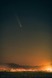 Scenic Night Sky With A Visible Comet Streaking Through Stars Above A Glowing Horizon – Free 4K HD Download