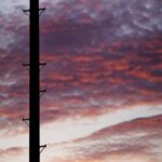 Vibrant Sunset Utility Pole Silhouette