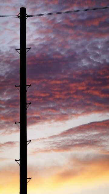 Vibrant Sunset Utility Pole Silhouette