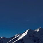 snow-capped-mountains-under-a-deep-blue-sky