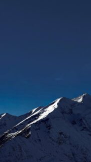 snow-capped-mountains-under-a-deep-blue-sky