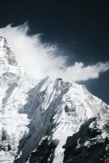Snow Covered Mountain Peak Against A Dark Sky – Free 4K HD Download