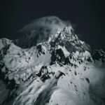Snowy Mountain Peak Wrapped in Clouds