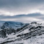 serene-snow-covered-mountains-under-a-cloudy-sky