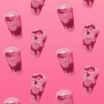 Sweet Treat: Strawberry Milkshakes with Hearts on Pink Background