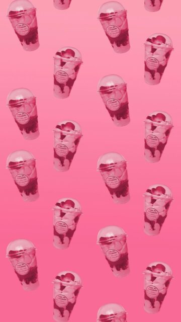 Sweet Treat: Strawberry Milkshakes with Hearts on Pink Background