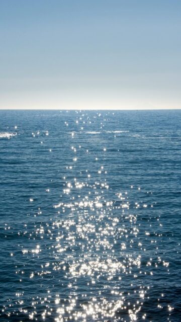 Oceanic Bliss: Sparkling Waves on Deep Blue Sea