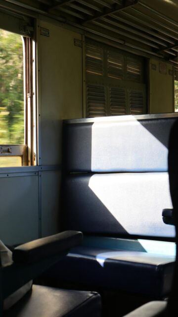 Empty Train Carriage Seats at Sunrise