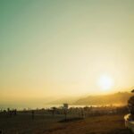 stunning-beach-sunset-with-distant-mountains