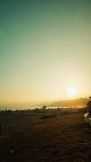 stunning-beach-sunset-with-distant-mountains