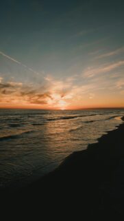 Calming Sunset over Calm Ocean with Wispy Clouds