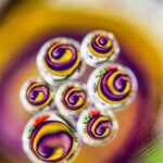 Whimsical Droplet Designs with Purple and Yellow Centers