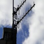 Charming TV Antenna on Chimney with Blue Sky